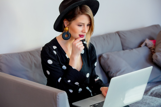 A young woman is looking at your business's online shopping site.